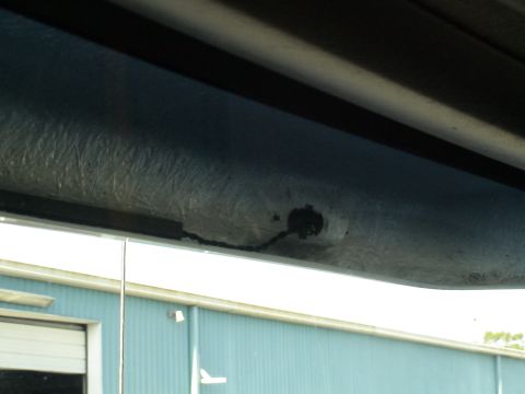 1993 Ford C-350 (Centurion Conversions) - Close-up view of a damaged moonvisor with a visible crack and exposed wiring.
