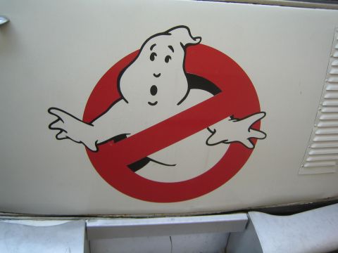 1990 Ford Bronco - Ghostbusters 'no-ghost' logo, a white ghost crossed by a red circle, is applied as a decal on a white body panel next to a vent.