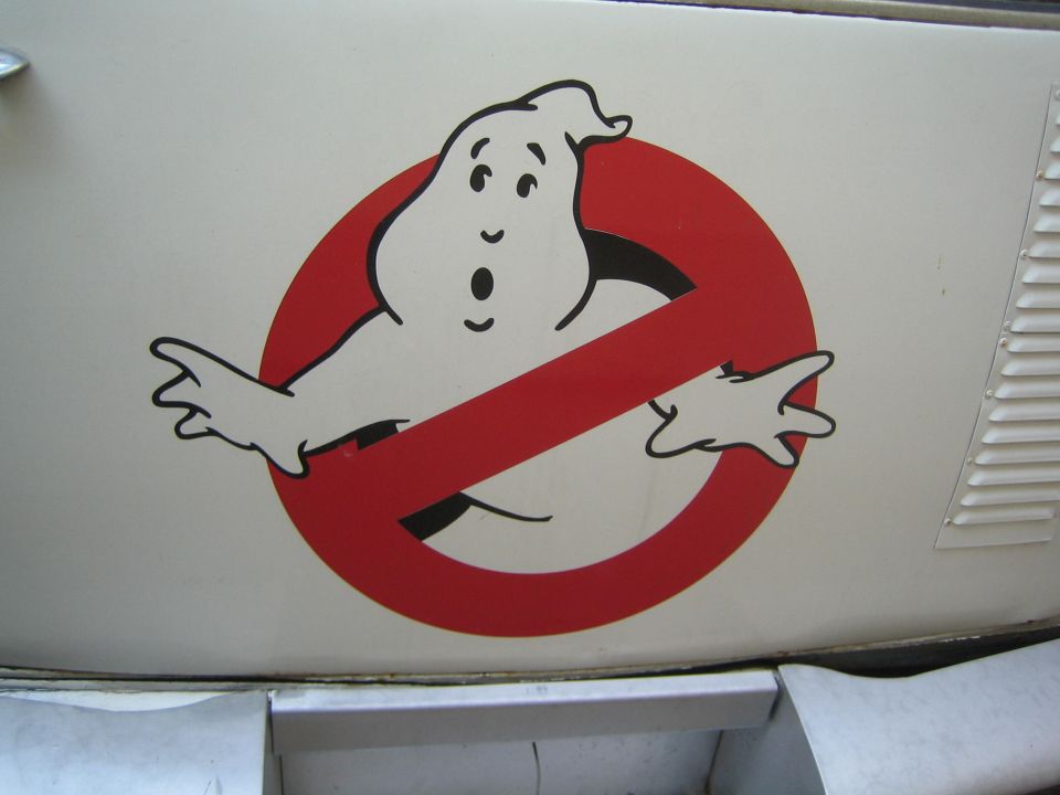 Ghostbusters 'no-ghost' logo decal on a white body panel beside a louvered vent