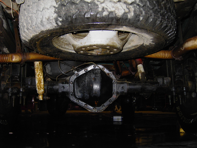 Underside view of a rear differential and spare tire