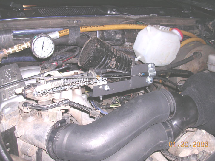 using a chain, I connected the new vernier throttle to the throttle linkage.  This allows full use of the gas pedal without the vernier affecting movement.