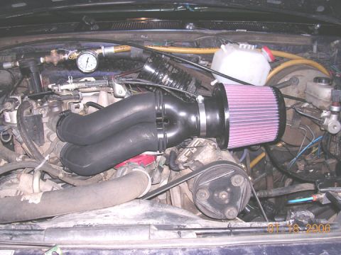 1994 Ford Bronco - The intake hose is out of a mid 90's pickup that had MAF. The filter is K/N #RX-4990. Total cost of project is about 50 or 60 bucks.