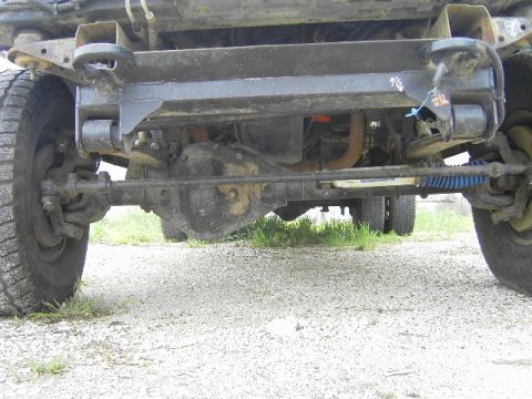 1995 GMC C/K Pickup - Front differential and suspension components visible on a truck's undercarriage.