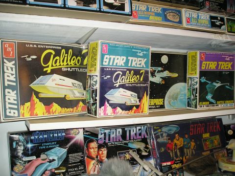 1984 Pontiac Fiero - Various Star Trek model kits are displayed on shelves, different spacecraft and characters from the series.