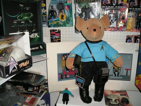 1984 Pontiac Fiero - A collection of Star Trek merchandise is displayed, action figures, model ships, and a teddy bear dressed as a Starfleet officer.