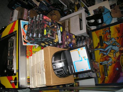 1984 Pontiac Fiero - A room filled with Star Trek collectibles, including toys, action figures, and a pinball machine.