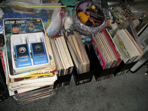1984 Pontiac Fiero - A collection of Star Trek merchandise is displayed, toys and numerous magazines.