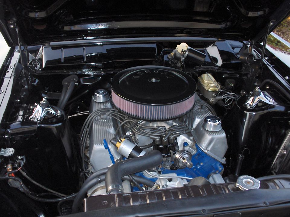 Engine bay with Ford V8 engine, air filter, and radiator