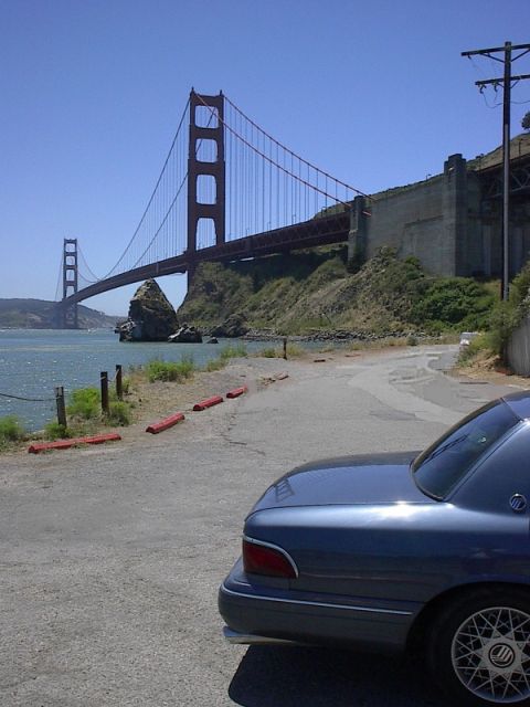 1985 Mercury Grand Marquis - Mercury Grand Marquis parked with the Golden Gate Bridge visible in the distance.