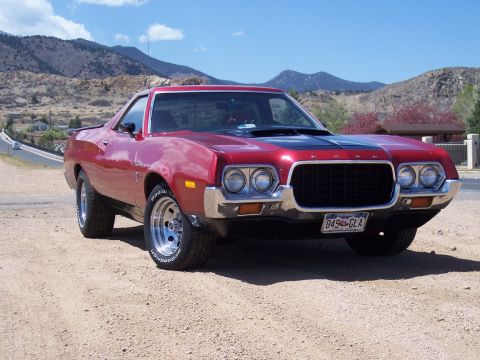 1972 Ford Ranchero - This red Ford Ranchero features a distinctive front grille and dual headlights, characteristic of early 1970s models.