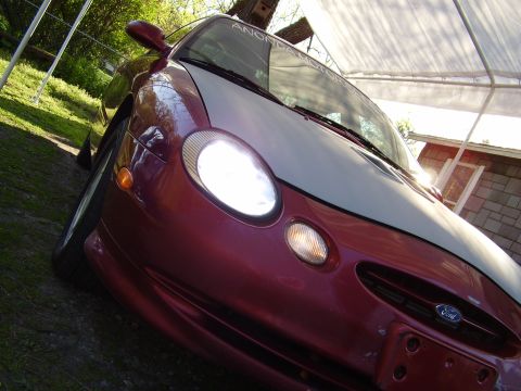 1997 Ford Taurus - Front view of a 1997 Ford Taurus, showing its distinctive headlights and grille.