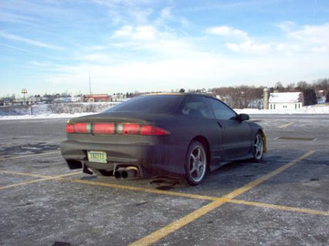 1994 Ford Probe - Rear view of a 1994 Ford Probe in a parking lot on a cloudy day.