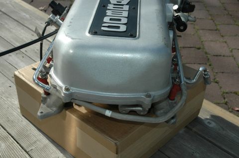 2000 Ford Mustang - A silver intake manifold with "COBRA" embossed on a black plate is shown.