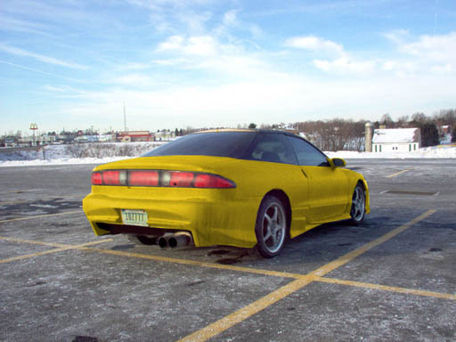 Yellow 1994 Ford Probe with a black roof and dual exhaust pipes, parked in a lot