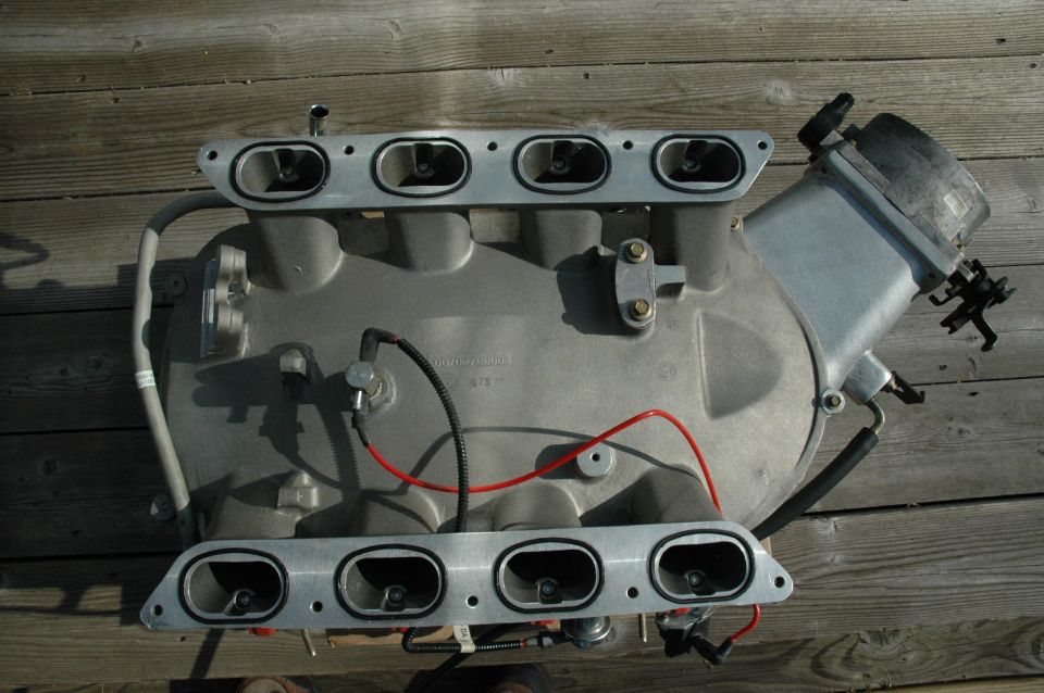 Intake manifold with red wires and sensors