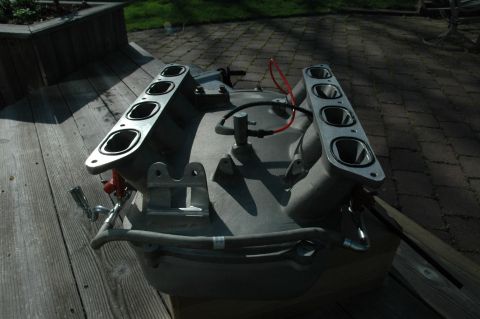 2000 Ford Mustang - This is an engine intake manifold, likely removed from a vehicle for repair or replacement.