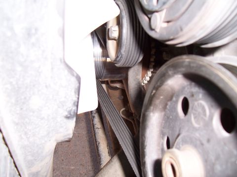 2003 Ford Ranger - A detailed view of the engine's belt system, highlighting the pulleys and tensioners.