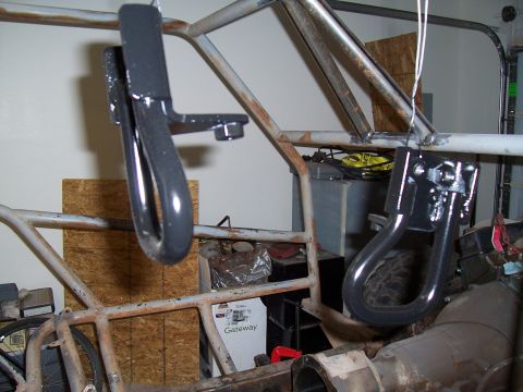 2003 Ford Ranger - Newly painted tow hooks are attached to the frame of a custom off-road vehicle.