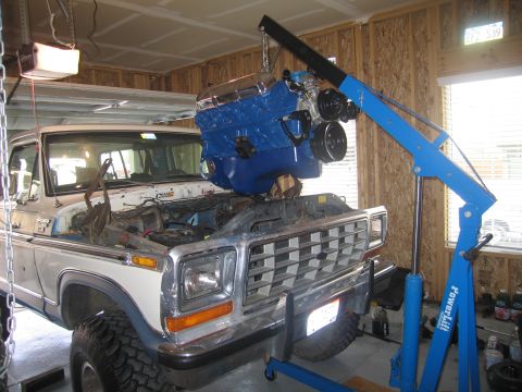 1979 Ford Bronco - In it goes... I had to take those L&L mounts off and bolt them to the frame perches and then bolt them to the engine.