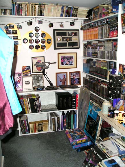 1984 Pontiac Fiero - A room dedicated to Star Trek collectibles, shelves packed with various memorabilia and media.