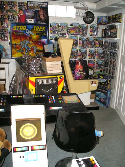 1984 Pontiac Fiero - Room filled with Star Trek merchandise and two vintage arcade cabinets.