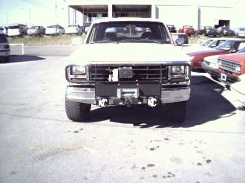 1982 Ford Bronco - This white Ford Bronco features KC lights and a winch mounted on the front bumper.