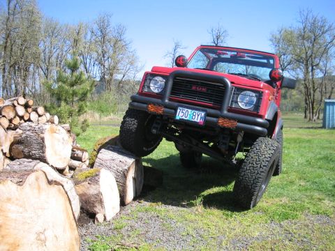 1987 Suzuki Samurai - This Suzuki Samurai is navigating an obstacle course made of logs.