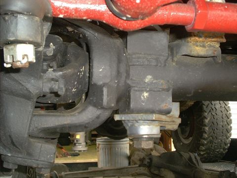 1978 Ford Bronco - Undercarriage view showing the complex mechanical components of a vehicle's suspension system.