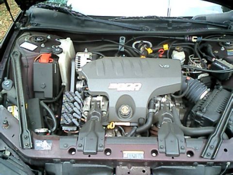 2002 Pontiac Grand Prix - The engine bay of a car, a V6 engine with "3800" visible on the cover.