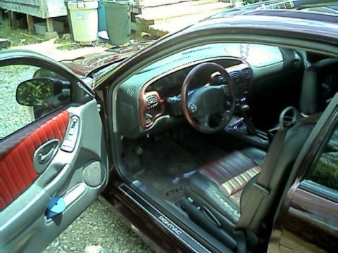 2002 Pontiac Grand Prix - The interior of a 2002 Pontiac Grand Prix shows off its leather seats and dashboard details.