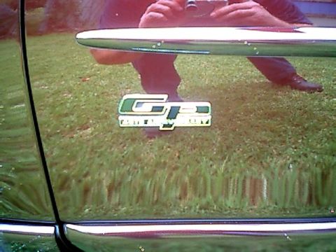 2002 Pontiac Grand Prix - The GP emblem is visible on the side of a red 2002 Pontiac Grand Prix.