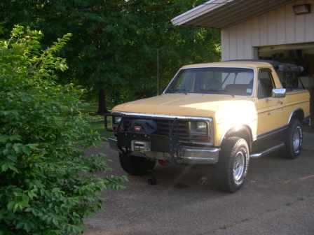 1982 Ford Bronco - This truck has a two-tone paint job with a black lower section and yellow upper section.