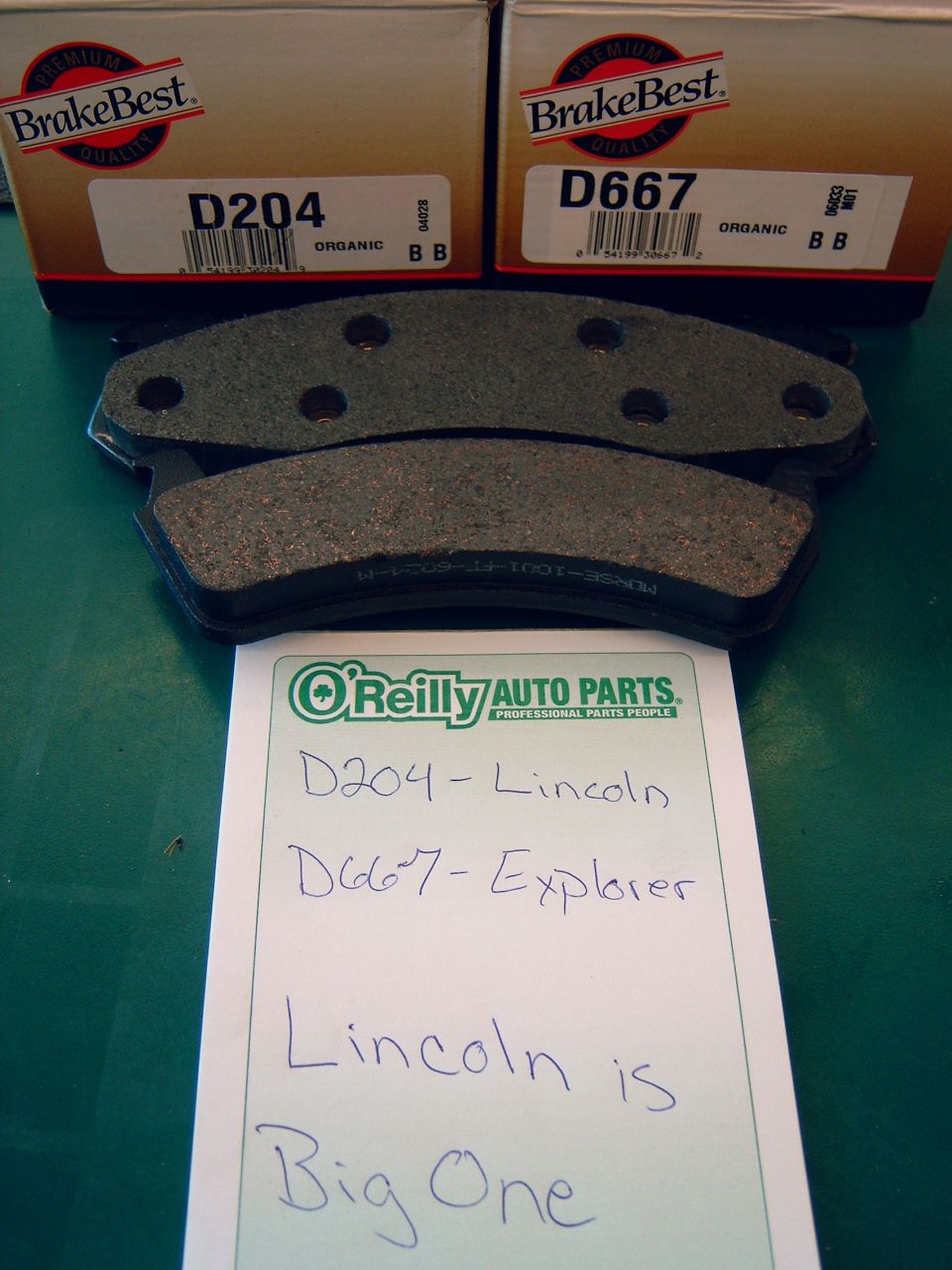 Two sets of BrakeBest brake pads with boxes labeled D204 and D667, and a handwritten note