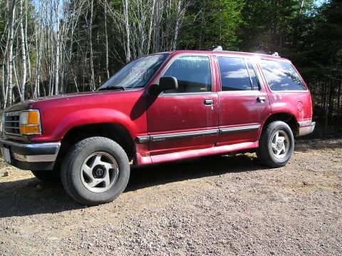 1991 Ford Explorer - This 1991 Ford Explorer is shown from the front three-quarter view, parked outdoors on a gravel surface.