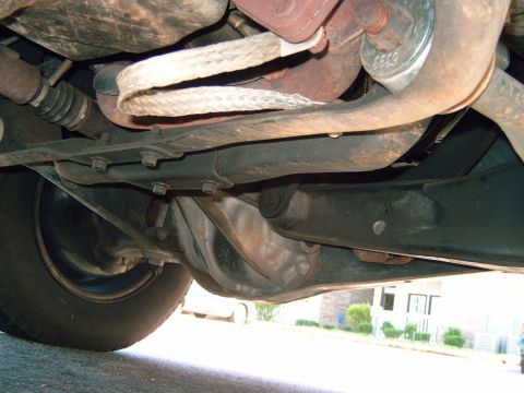 1993 Ford Explorer - A view of the undercarriage, showing suspension and exhaust parts.