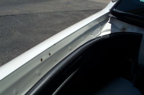 2001 Ford Crown Victoria - Holes from the antenna mounts. I filled them with clear silicon.
