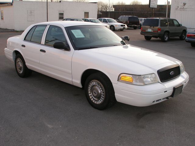 White 2001 Ford Crown Victoria, 3q front view. Paper on windshield