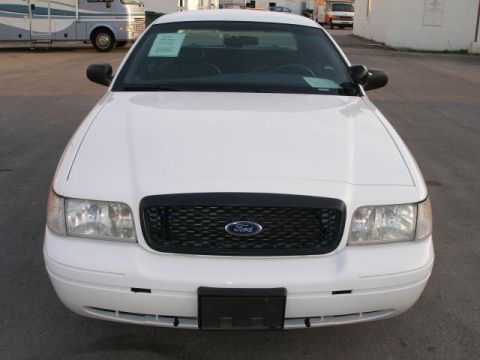 2001 Ford Crown Victoria - Frontal view of a white 2001 Ford Crown Victoria sedan.