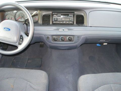 2001 Ford Crown Victoria - Interior view of a 2001 Ford Crown Victoria, showing the dashboard, steering wheel, and center console.