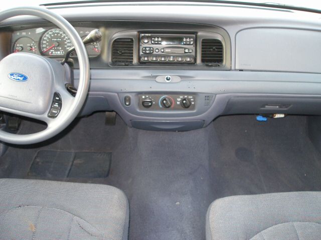 2001 Ford Crown Victoria interior dashboard with steering wheel and radio