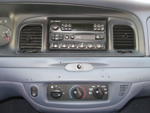 2001 Ford Crown Victoria - Interior view of a 2001 Ford Crown Victoria, showing the center console with radio and HVAC controls.