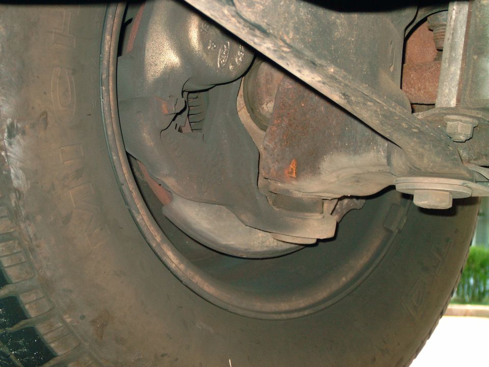 Close-up of a vehicle's wheel and suspension system