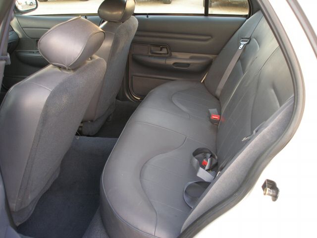 2001 Ford Crown Victoria interior, gray seats, rear bench seat, door panel visible