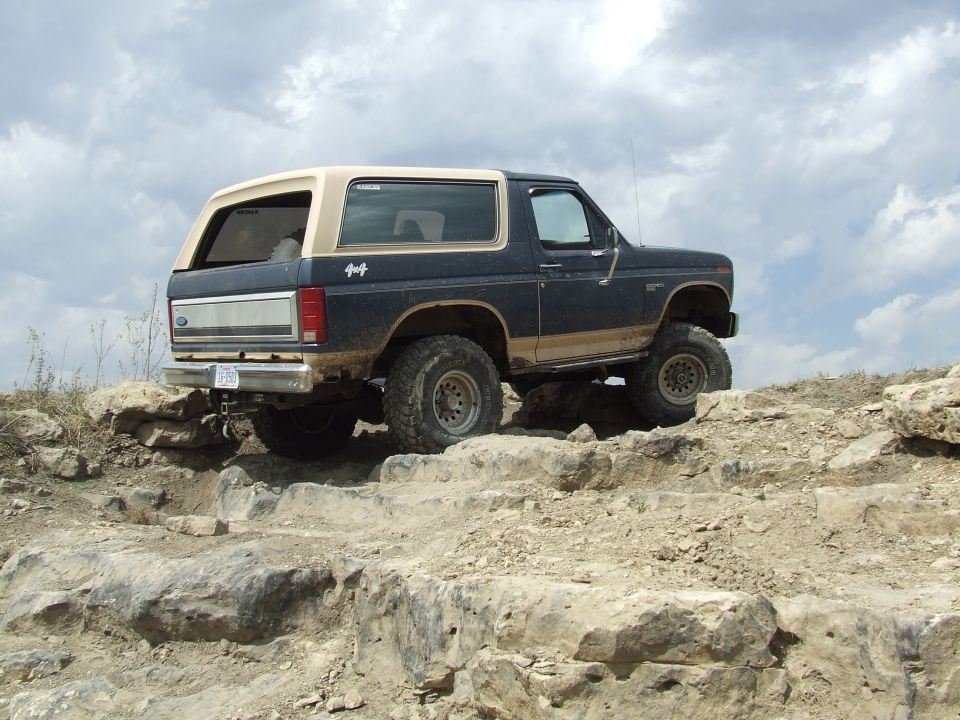 1986 Ford Bronco navigating rocky terrain