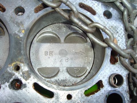 1993 Ford Taurus - This image shows a close-up view of an engine's cylinder and piston, with visible markings indicating its components.