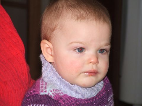 1966 Ford Ranchero - Baby in a purple sweater with a turtleneck, with a watermark for Supermotors.net.