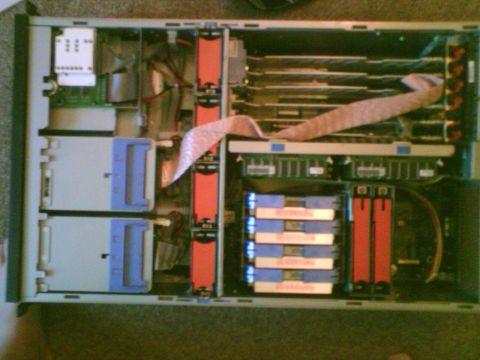 1985 Ford F-150 - The internal components of a computer server are visible, including drives and wiring.
