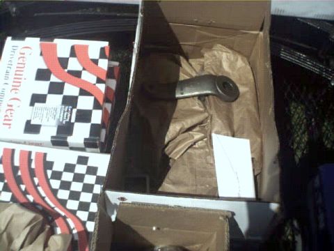 1996 Ford Bronco - A metal automotive part is packaged in a cardboard box with packing paper.