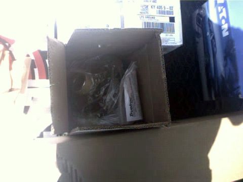 1996 Ford Bronco - Box of parts, including one labeled Truetrac, sits on a surface.