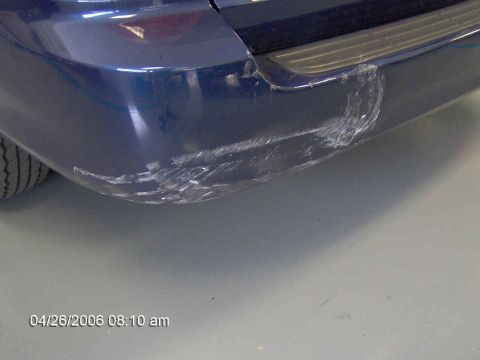 1999 Ford Taurus - Rear bumper damage visible on a blue vehicle. Photo taken April 26, 2006.